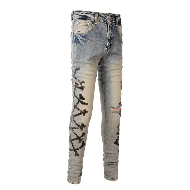 Amiri Jeans blue slim straight leg jeans with ripped print