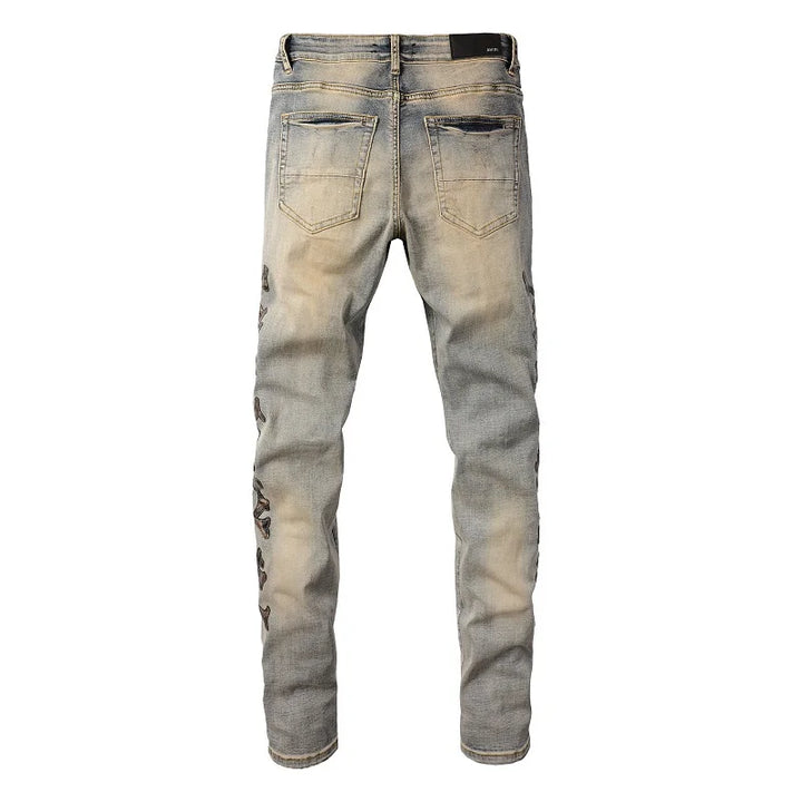 Amiri Jeans blue slim straight leg jeans with ripped print