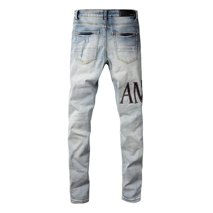 Amiri Jeans gray and black printed slim straight leg ripped jeans