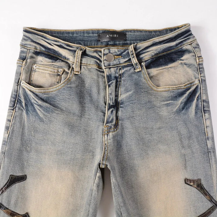 Amiri Jeans blue slim straight leg jeans with ripped print