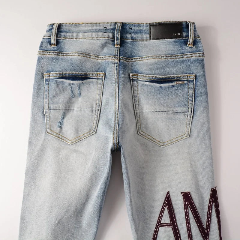 Amiri Jeans gray and black printed slim straight leg ripped jeans