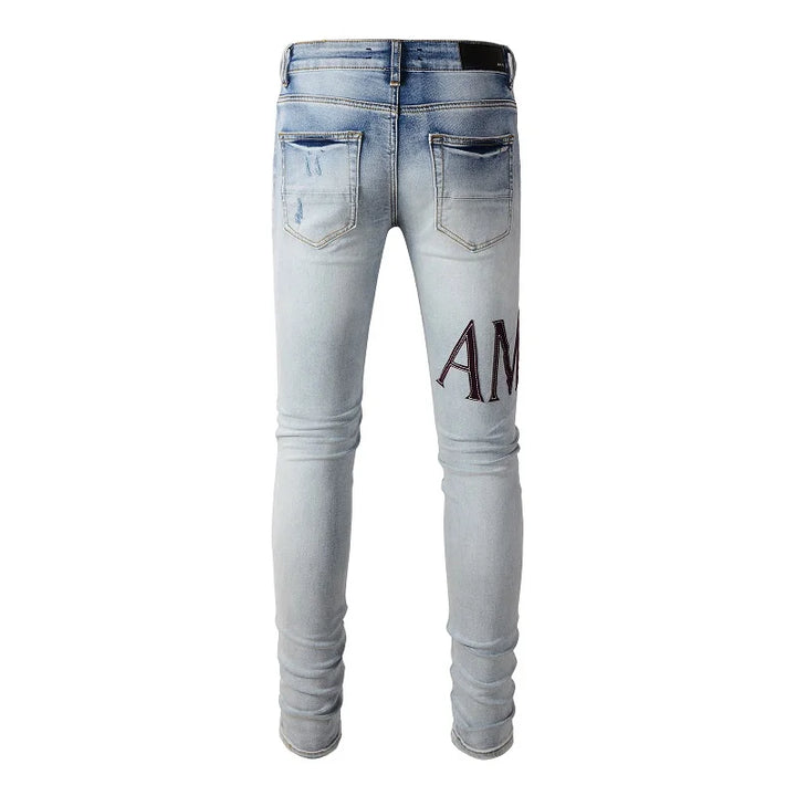 Amiri Jeans gray and black printed slim straight leg ripped jeans