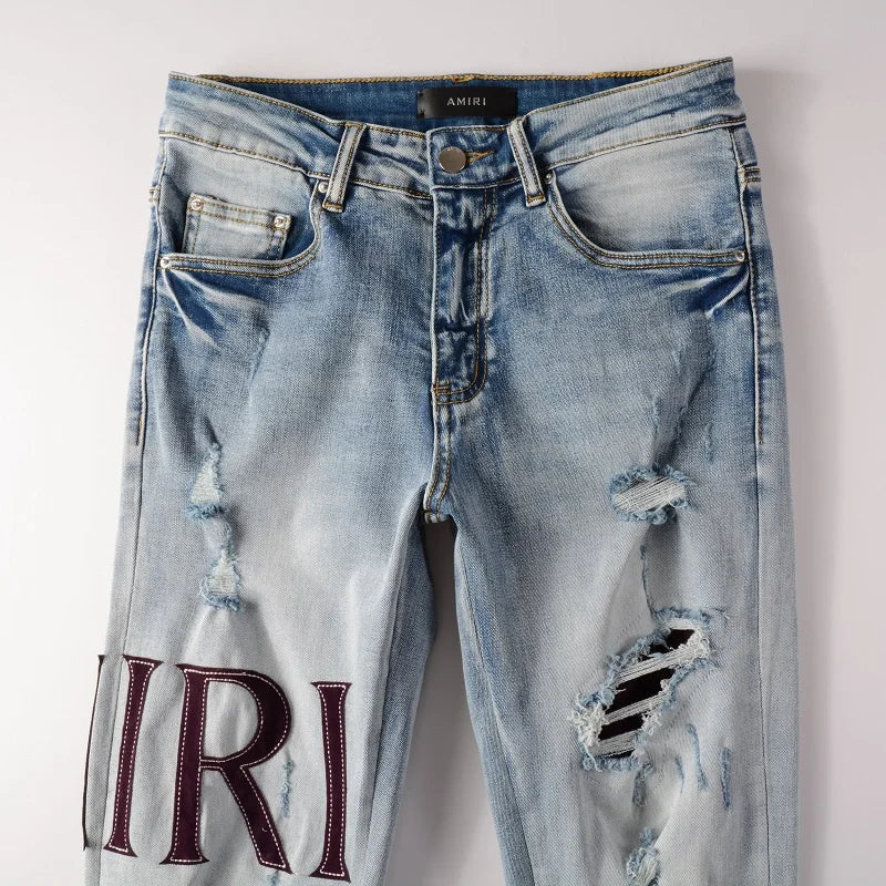 Amiri Jeans gray and black printed slim straight leg ripped jeans