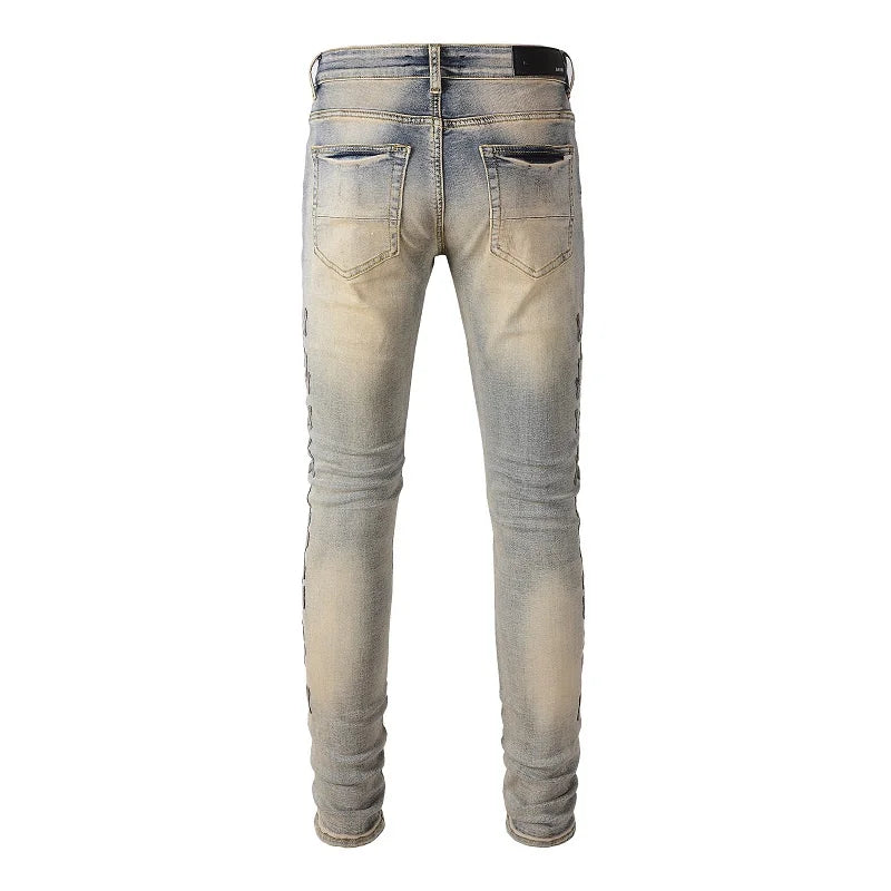 Amiri Jeans blue slim straight leg jeans with ripped print